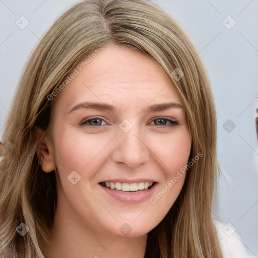 Joyful white young-adult female with long  brown hair and blue eyes