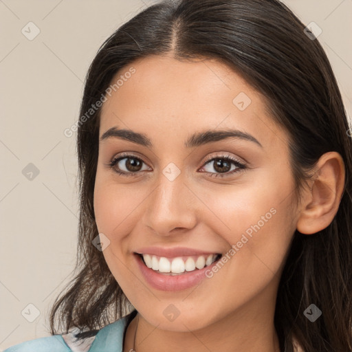 Joyful white young-adult female with long  brown hair and brown eyes