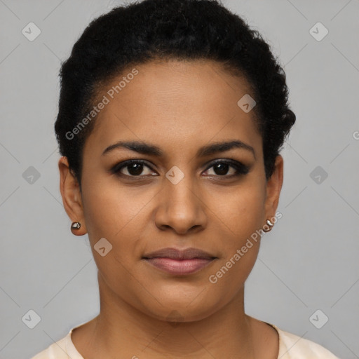 Joyful black young-adult female with short  black hair and brown eyes