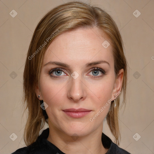 Joyful white young-adult female with medium  brown hair and blue eyes