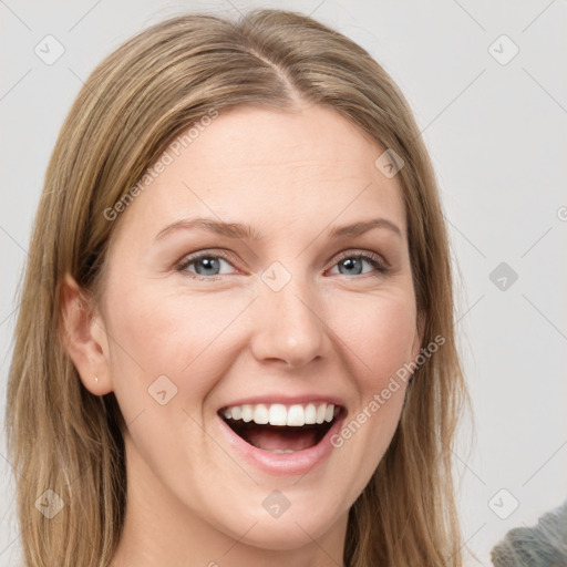 Joyful white young-adult female with medium  brown hair and green eyes