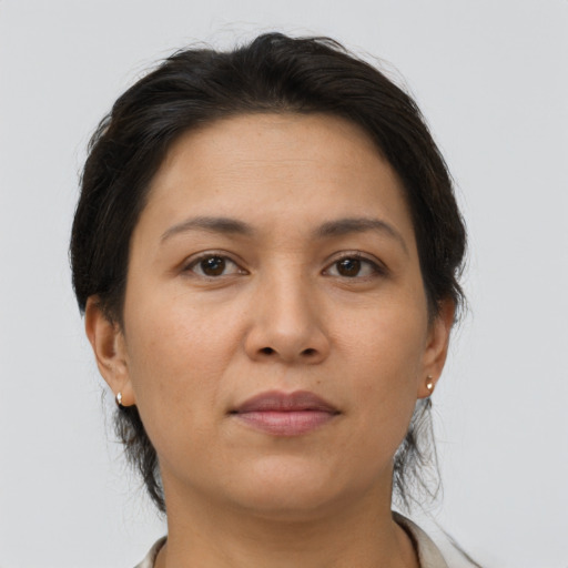Joyful asian young-adult female with short  brown hair and brown eyes