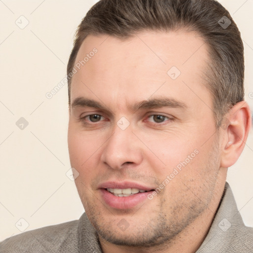 Joyful white adult male with short  brown hair and brown eyes