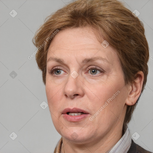 Joyful white adult female with medium  brown hair and grey eyes