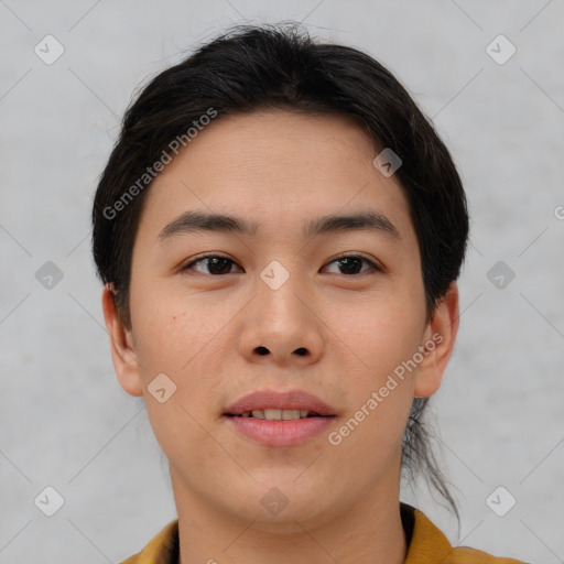 Joyful asian young-adult male with short  brown hair and brown eyes