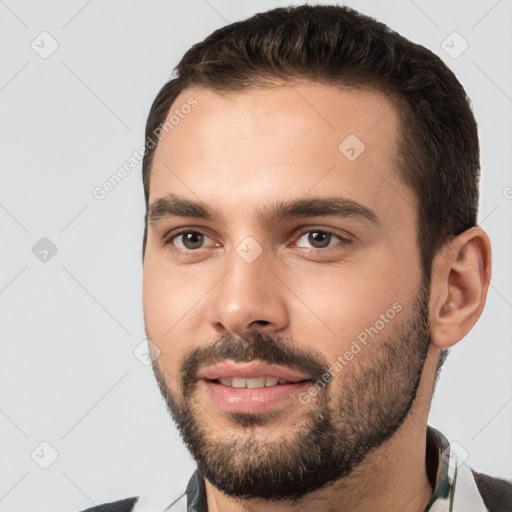 Joyful white young-adult male with short  brown hair and brown eyes