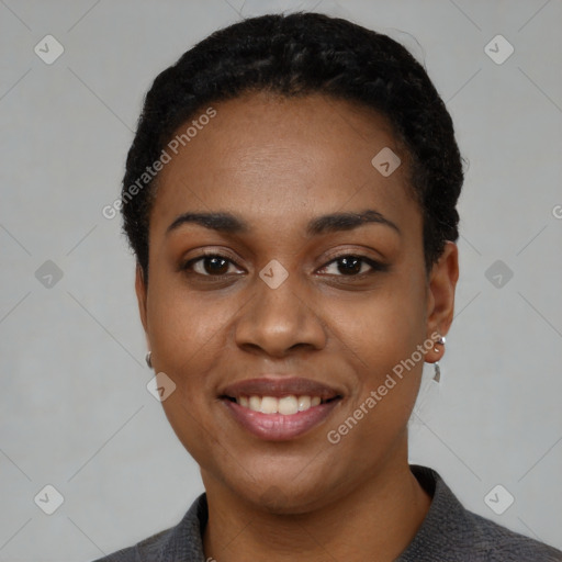 Joyful black young-adult female with short  black hair and brown eyes