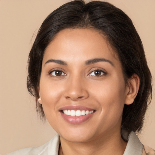 Joyful white young-adult female with medium  brown hair and brown eyes