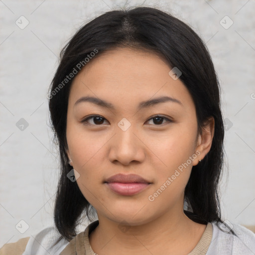 Joyful asian young-adult female with medium  black hair and brown eyes