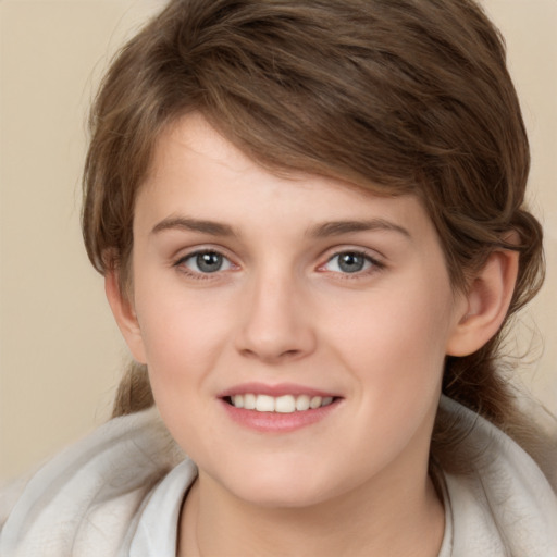 Joyful white child female with medium  brown hair and brown eyes