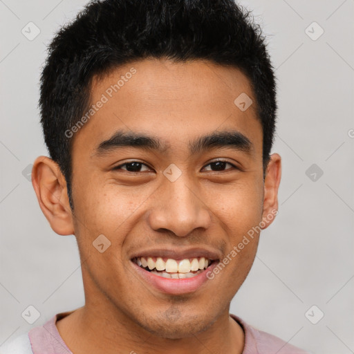 Joyful latino young-adult male with short  brown hair and brown eyes