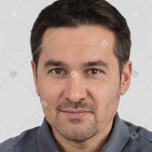 Joyful white adult male with short  brown hair and brown eyes