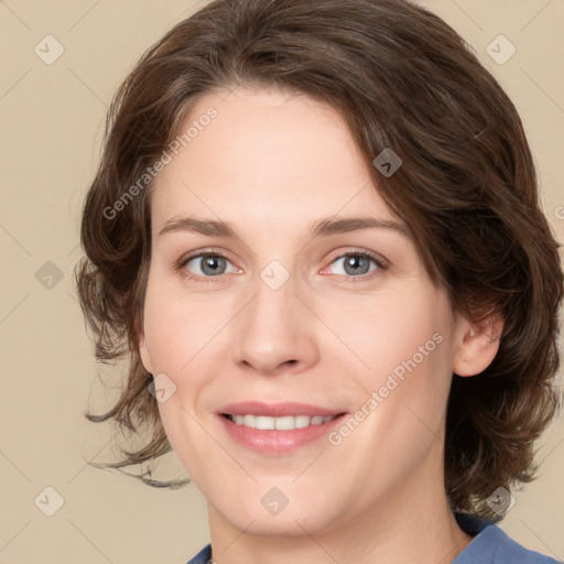 Joyful white young-adult female with medium  brown hair and green eyes