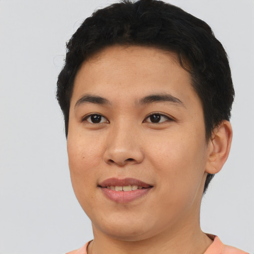Joyful asian young-adult male with short  brown hair and brown eyes