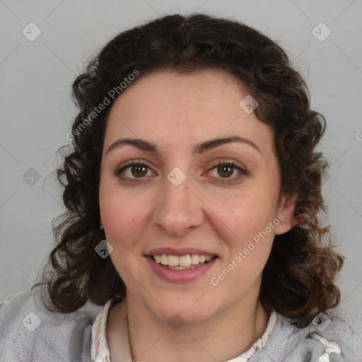 Joyful white adult female with medium  brown hair and blue eyes