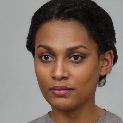 Neutral black young-adult female with short  black hair and brown eyes