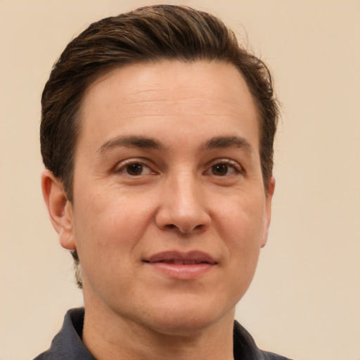 Joyful white adult male with short  brown hair and brown eyes