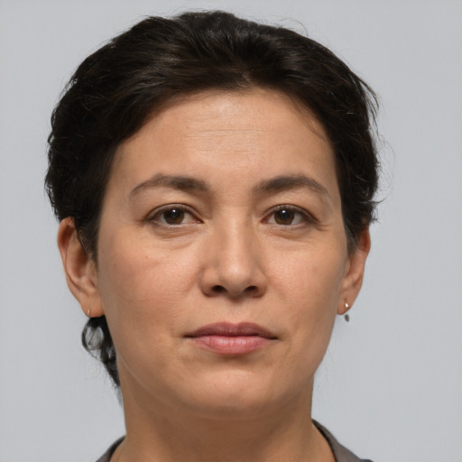 Joyful white adult female with short  brown hair and brown eyes