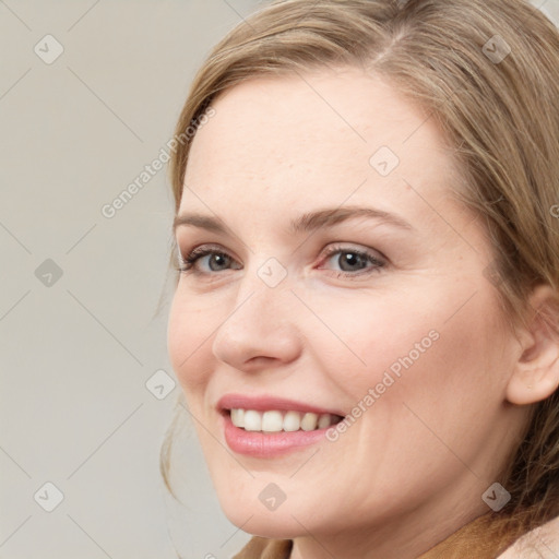 Joyful white young-adult female with medium  brown hair and blue eyes