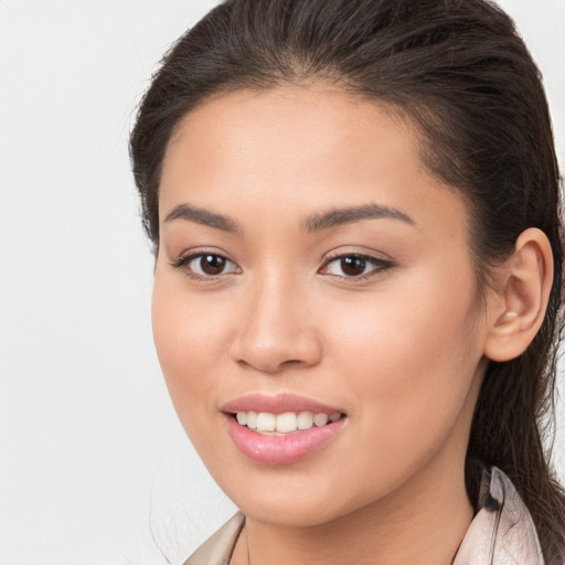 Joyful white young-adult female with long  brown hair and brown eyes