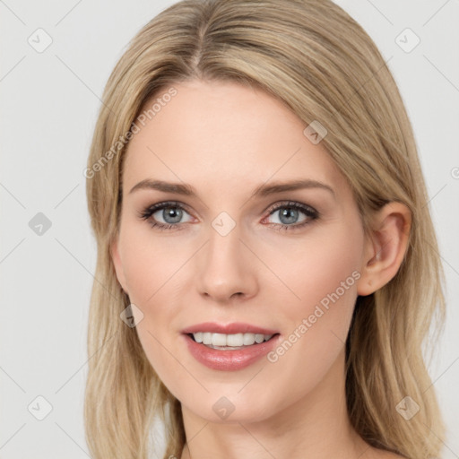 Joyful white young-adult female with long  brown hair and blue eyes