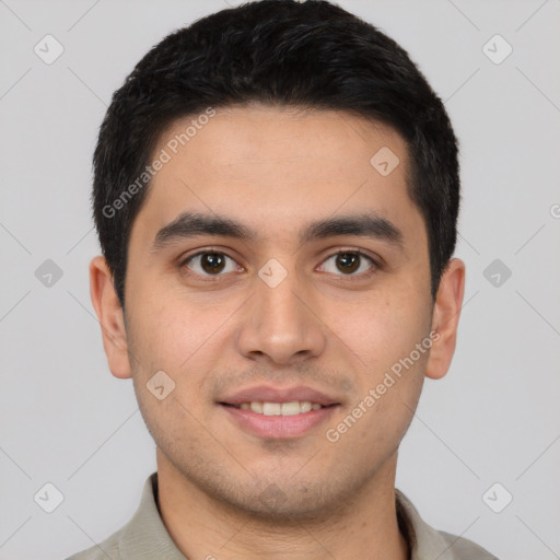 Joyful latino young-adult male with short  brown hair and brown eyes