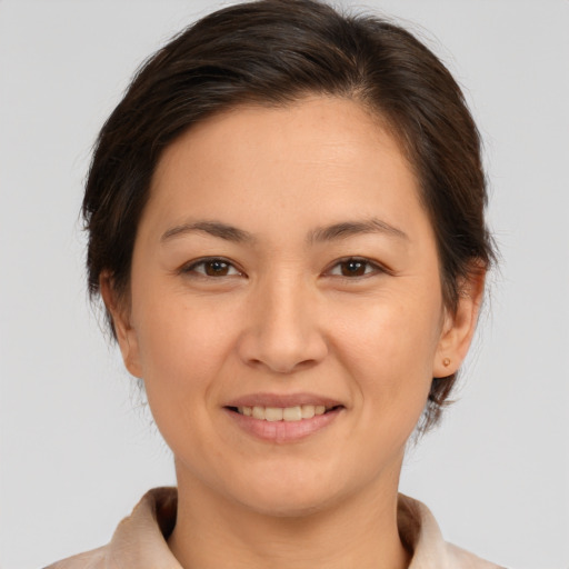 Joyful white young-adult female with medium  brown hair and brown eyes