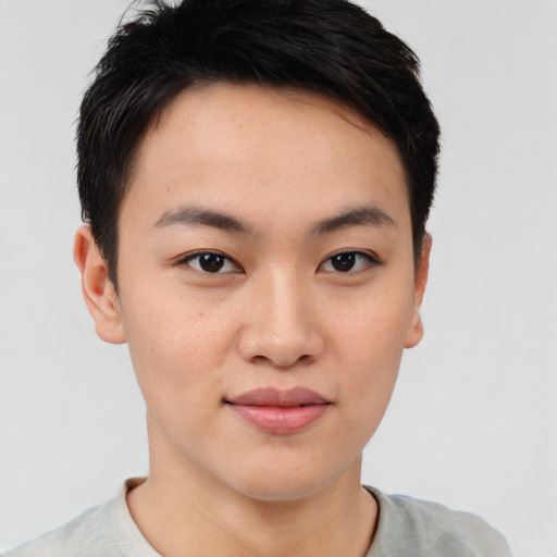 Joyful asian young-adult male with short  brown hair and brown eyes