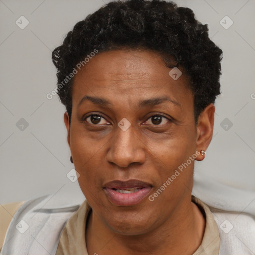 Joyful black adult female with short  brown hair and brown eyes