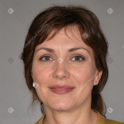 Joyful white adult female with medium  brown hair and brown eyes