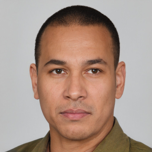 Neutral latino adult male with short  black hair and brown eyes