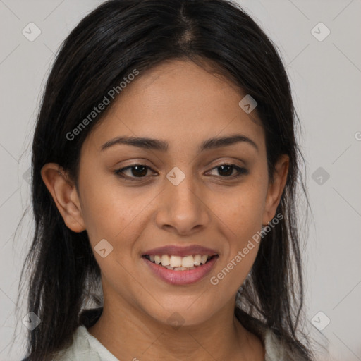 Joyful latino young-adult female with long  brown hair and brown eyes