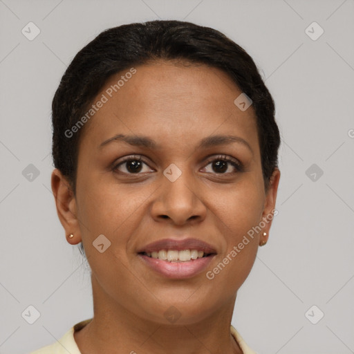 Joyful black young-adult female with short  brown hair and brown eyes