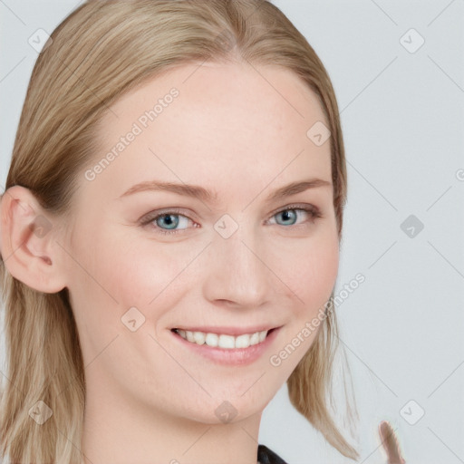 Joyful white young-adult female with long  brown hair and blue eyes