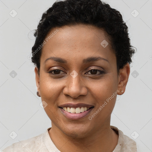 Joyful black young-adult female with short  black hair and brown eyes