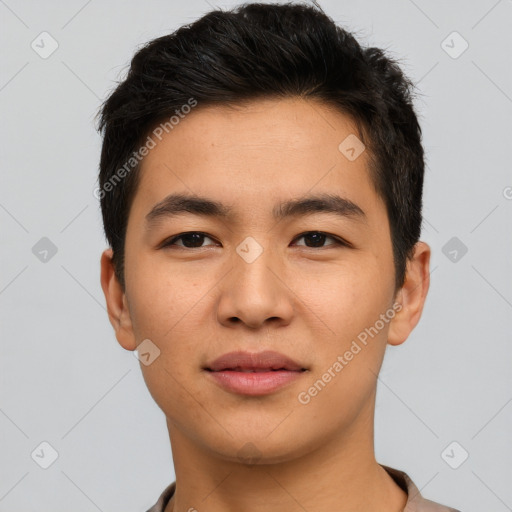 Joyful asian young-adult male with short  brown hair and brown eyes