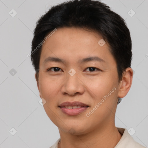 Joyful asian young-adult male with short  brown hair and brown eyes