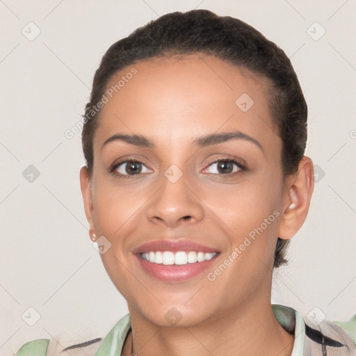 Joyful white young-adult female with short  brown hair and brown eyes