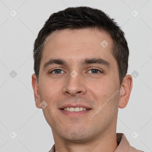 Joyful white young-adult male with short  brown hair and brown eyes