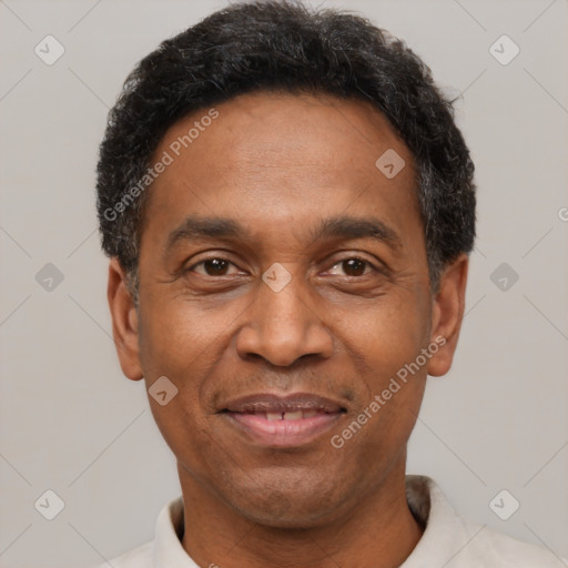 Joyful latino adult male with short  black hair and brown eyes