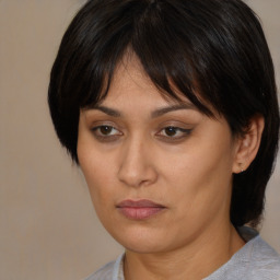 Neutral asian young-adult female with medium  brown hair and brown eyes