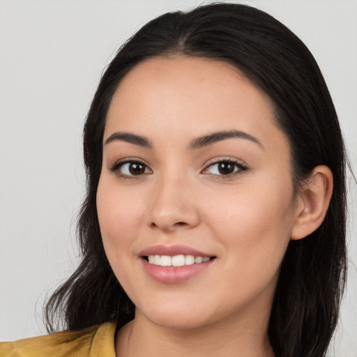 Joyful white young-adult female with long  black hair and brown eyes