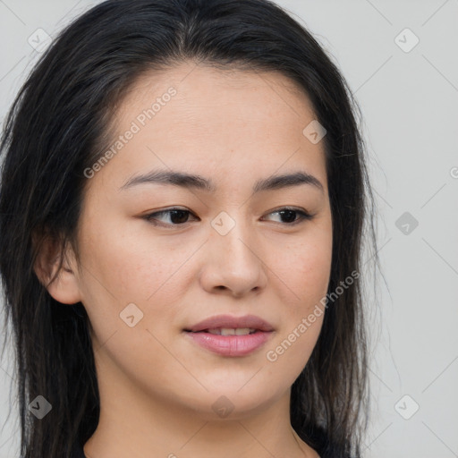 Joyful asian young-adult female with long  brown hair and brown eyes