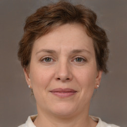 Joyful white adult female with short  brown hair and brown eyes