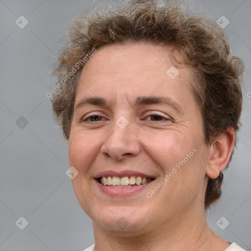 Joyful white adult female with short  brown hair and brown eyes