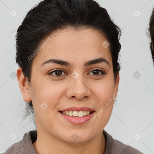 Joyful latino young-adult female with short  brown hair and brown eyes