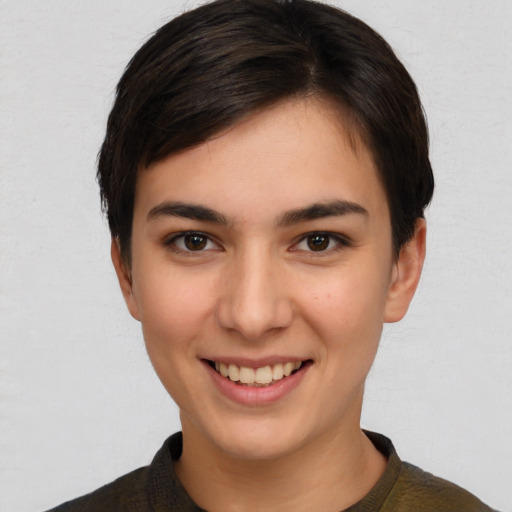 Joyful white young-adult female with short  brown hair and brown eyes