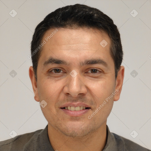 Joyful white adult male with short  black hair and brown eyes