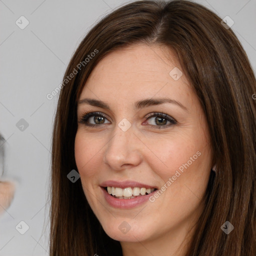 Joyful white young-adult female with long  brown hair and brown eyes