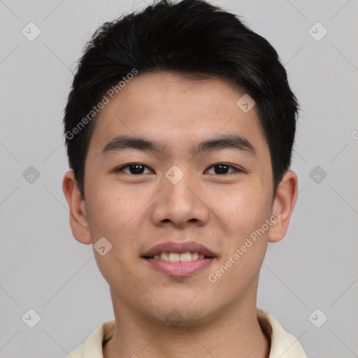 Joyful asian young-adult male with short  brown hair and brown eyes